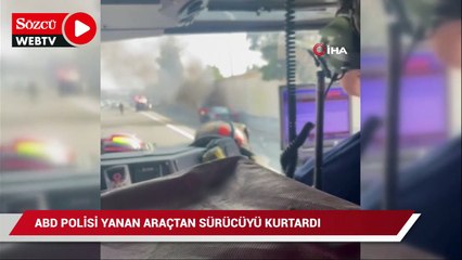 ABD polisi otoyolda yanan aracın sürücüsünü kurtardı