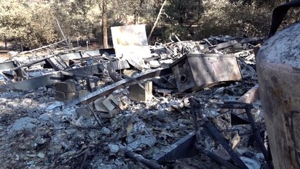 Families return to homes leveled by California wildfires