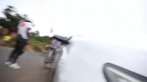 Guy Longboarding Downhill Collides With Bike Coming From Opposite Direction