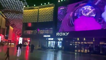 The City Walk crowd watch the opening ceremony on the big screen