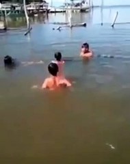 Crocodile child playing with Indonesian children