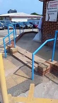 The moment a fuming social housing tenant dumps rubble from a collapsed wall at his home at Chesterfield Borough Council offices