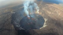 Lava flows and flies as volcano returns to life in Hawaii