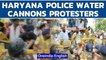 Haryana Police use water cannon on farmers protesting outside CM Khattar's house | Oneindia News