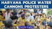 Haryana Police use water cannon on farmers protesting outside CM Khattar's house | Oneindia News
