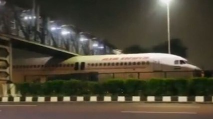 Image of the day: Air India plane gets stuck under a foot over bridge in Delhi