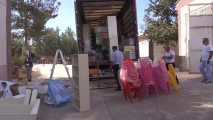 "Elmacı Dede" Mardin ve Suriye'deki ana sınıflarına malzeme desteği sundu