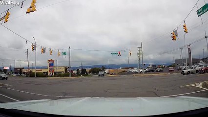 Car Runs Red Light in Front of Police