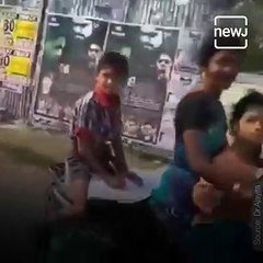 Video Of Little Boy Doing Homework On Scooty Goes Viral.