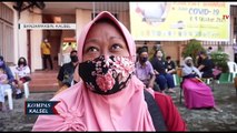 Takut Jarum Suntik, Seorang Wanita di Banjarmasin Peluk Petugas Saat Jalani Vaksinasi Covid-19