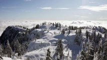mixkit-snowy-hills-with-clouds-3371