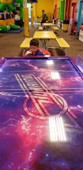 Kid Doesn't Quite Understand Air Hockey