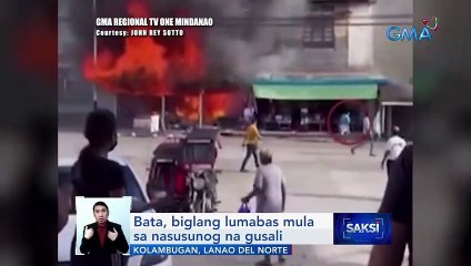 Bata, biglang lumabas mula sa nasusunog na gusali | Saksi