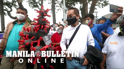 Salvador Panelo talks to the media before he files his COC for senator