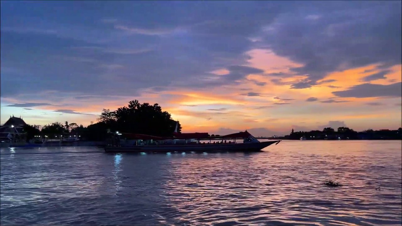 Boats on the Chao Phraya River of Koh Kret Island in Thailand
