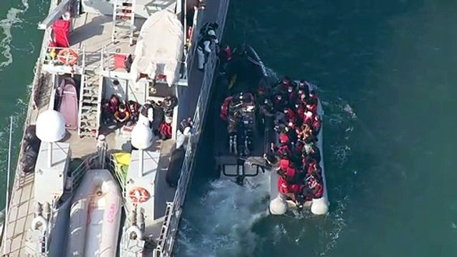 Aerial shots show UK Border Force collecting migrants