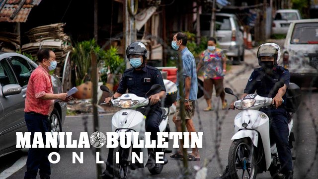 Malaysia eases travel curbs as COVID outbreak slows