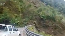 Massive landslide crashes onto road