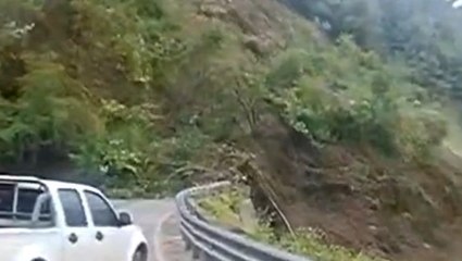 Massive landslide crashes onto road