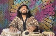 Musician Enjoys Thoroughly While Playing Indian Classical Music on Set of Hand Drums Called Tablas