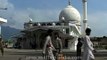 Pigeons fly over the Jama Mosque in Srinagar