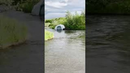 Wind Gust Sends Tent Into River