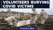 Indonesian volunteers help to bury COVID victims |  Coronavirus Pandemic | OneIndia News