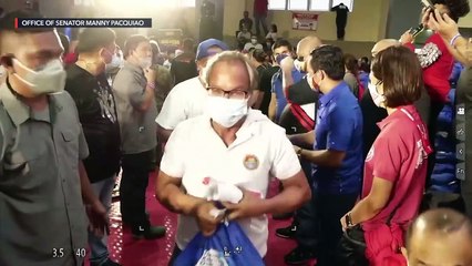 Senator Manny Pacquiao gives cash to Taal Volcano eruption victims