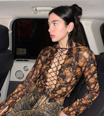 Dua Lipa Went Braless in a Sheer Lace-Up Shirt