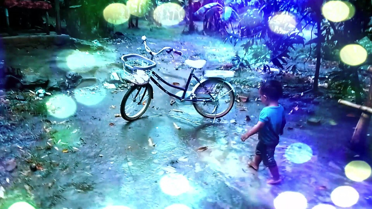 Baby funny playing in the rain first time happy fun and fun