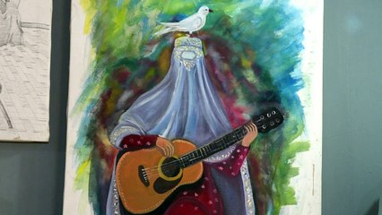 فنانون أفغان يرسمون آمالهم وآلامهم على الجدران في المنفى الطاجيكي
