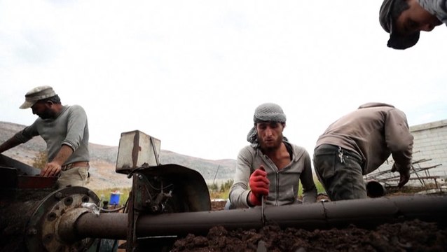 Syrians use olive waste as an alternative heat fuel source