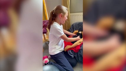 Adorable moment a young girl burst into tears of joy after coming home to her new puppy.