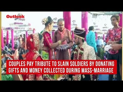 Couples pay tribute to slain soldiers by donating gifts and money collected during mass-marriage