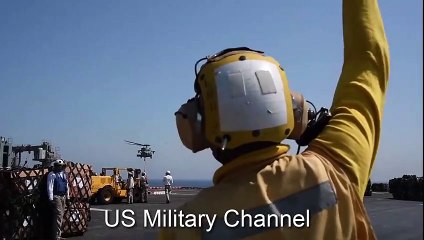 Aviation Boatswain’s Mate Directs a MH-60S Sea Hawk Aboard Amphibious Assault Ship USS Essex