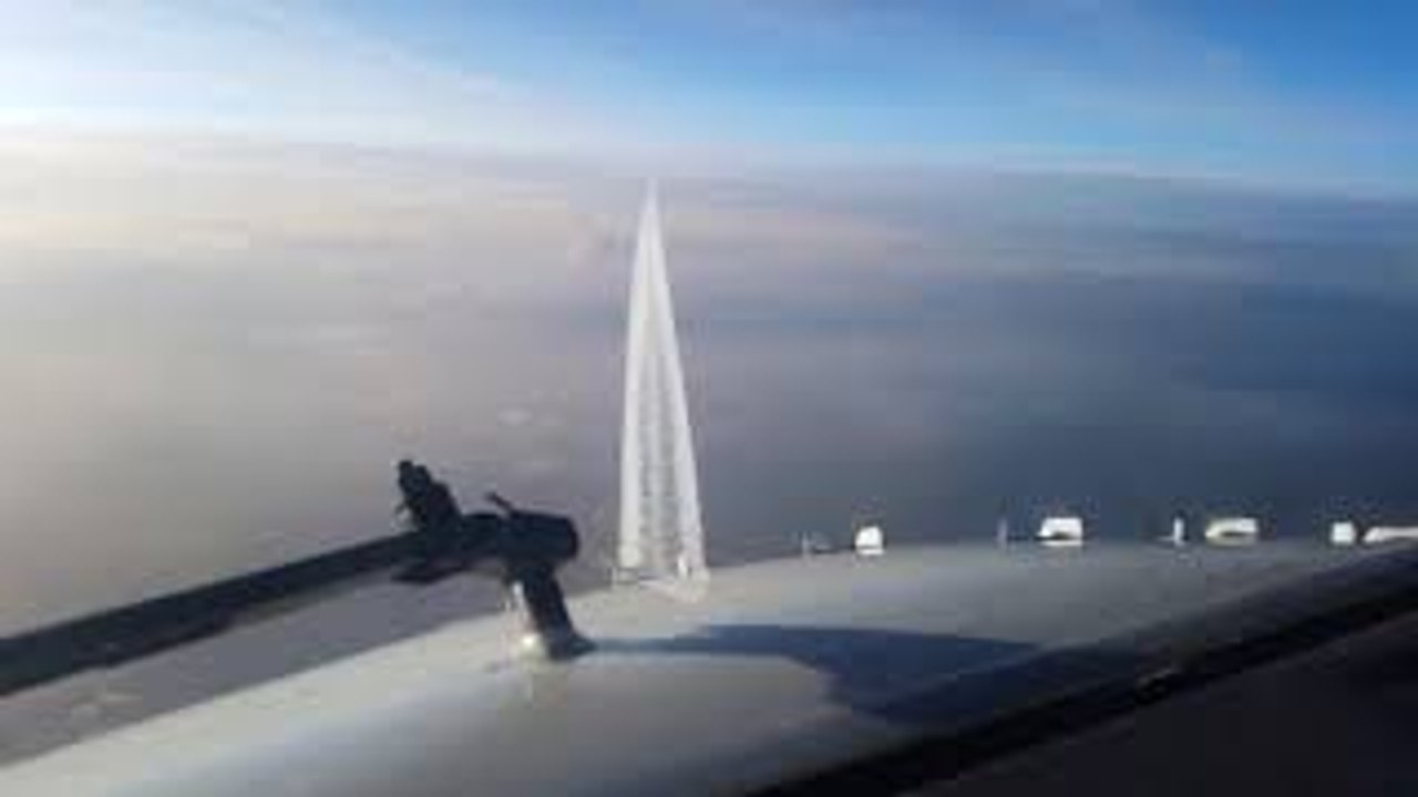 Oncoming Aircraft Passes Beneath Plane
