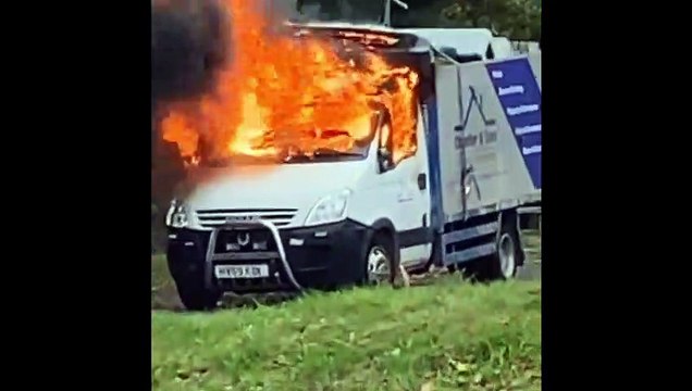 Van bursts into flames as children play football nearby
