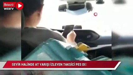 Seyir halinde at yarışı izleyen taksici pes dedirtti