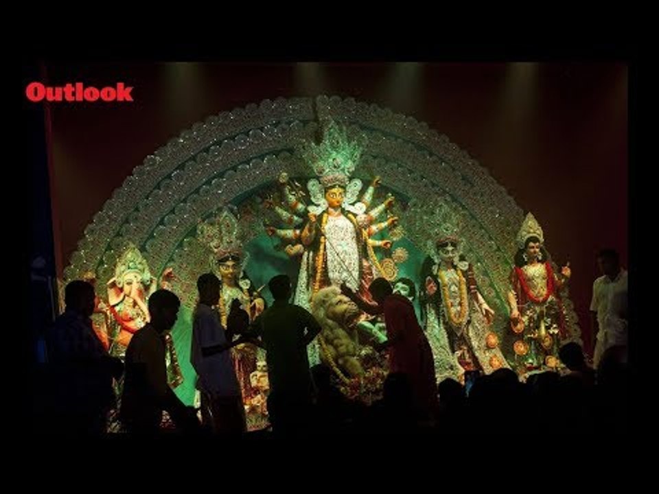 Devotees perform prayer during Durga Puja in Bengal