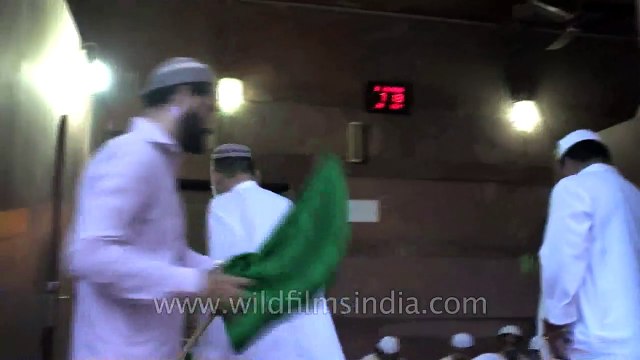 Muslims performing Iftar at the holy shrine of Jama Masjid, Old delhi