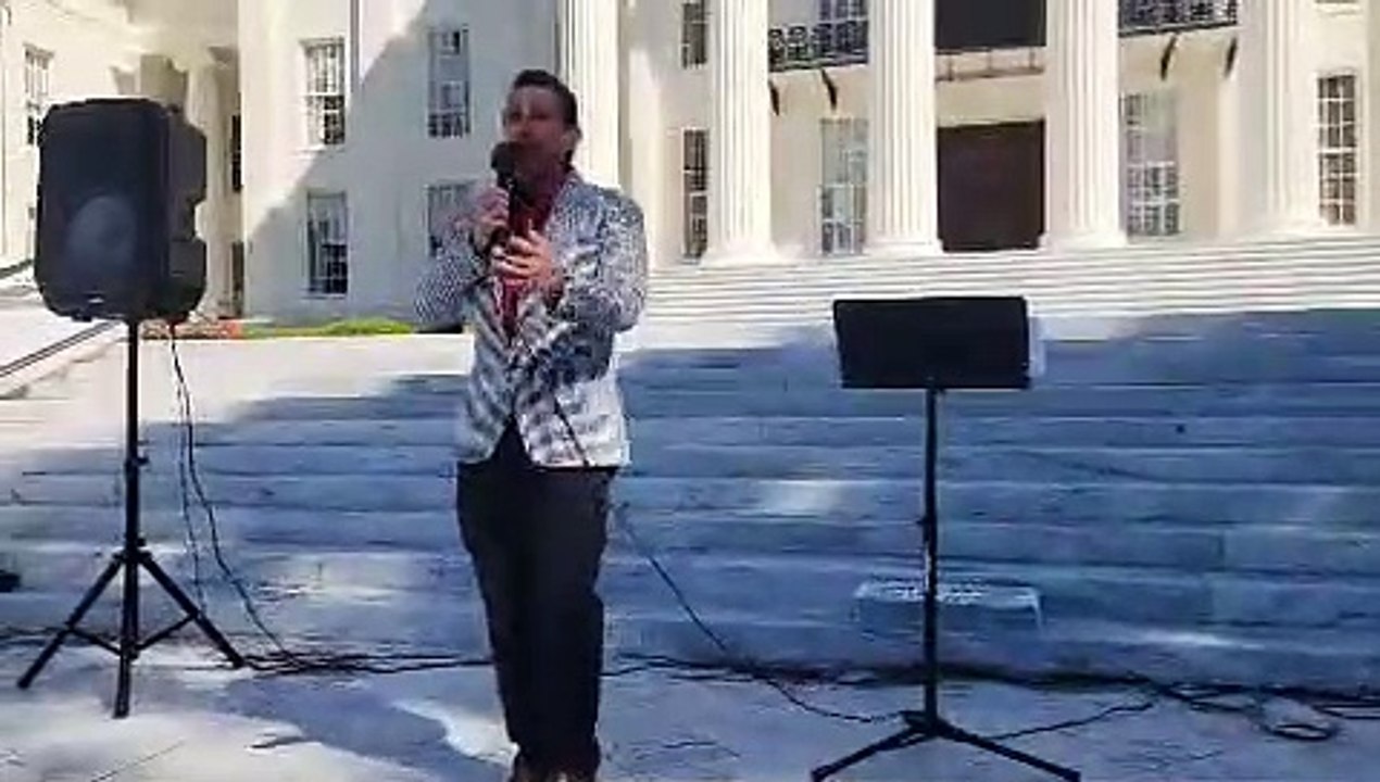 Christopher Key speaks at the state capital. "It is time the government fears the people."