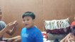 Boy Watches in Amazement While Sibling Performs Magic Trick