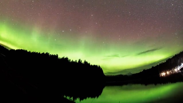 Aurora borealis shimmers alongside the Milky Way