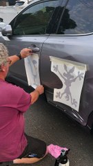 Car Damage Decorated With Looney Tunes Stickers