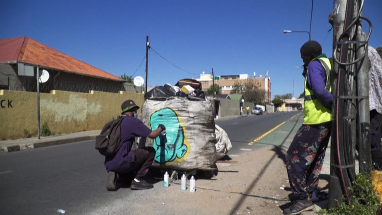 Artists seek to call attention to South Africa's unseen hands of recycling