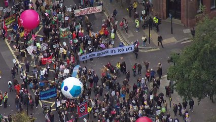 Climate change protesters march across central London