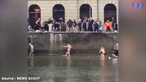 Des passants retournent une voiture tombée à l'eau