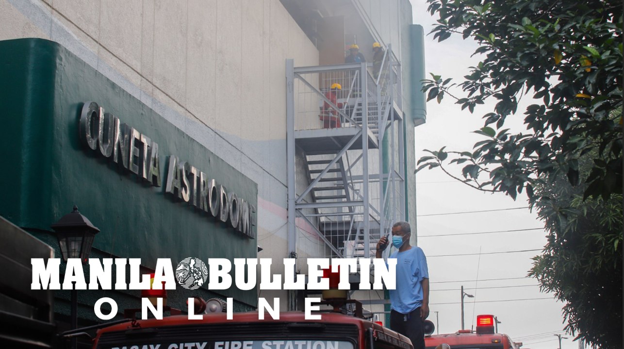 Firefighters respond to a fire that broke out at the Cuneta Astrodome in Pasay City