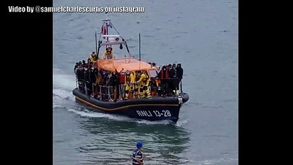 Migrants  land on a beach in Hastings