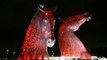 The Kelpies And Falkirk Steeple Lit Red